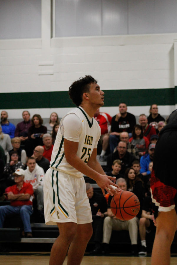 Hold Your Breath: #25 Varsity Trystin Sulich prepares to throw a free throw for his team. 