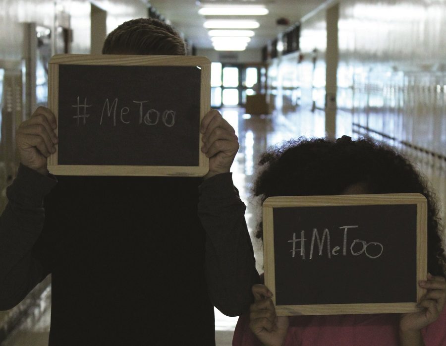 Two students hold chalkboards with #MeToo written on them. The #MeToo movement in the media has encouraged survivors of sexual assault, both famous and nonfamous, to come forward with their stories.