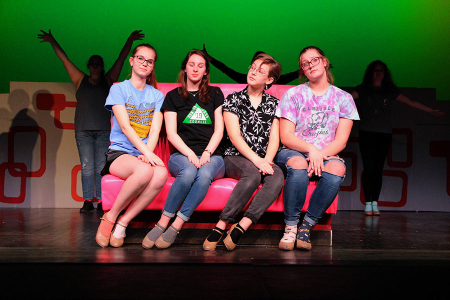 The Pink Ladies played by Talia Clash, Kelsey Sheffe and Bri Murrary, are joined by Chloe Kot (playing Patty Simcox) on stage as the ensemble dances behind them. Participating in the musical allows students to experience the process of staging a musical.