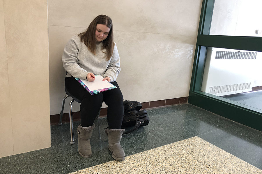 Kate Manti, an 11th grader, continuing her writing in an open atmosphere 