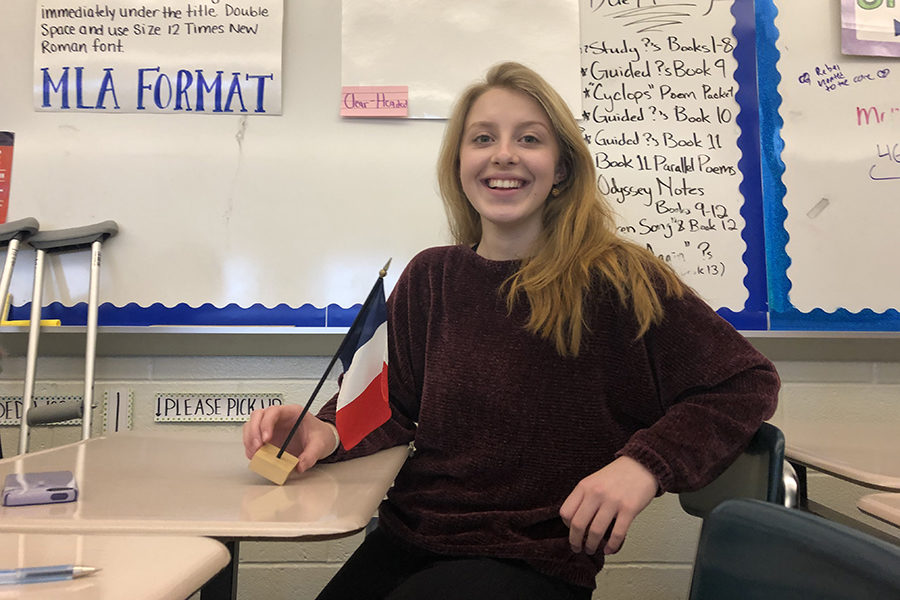 CHS Freshman Hannah Alwine is pictured above with a French flag.  Alwine will be spending a 10 month school year abroad in France through the AFS program and a local fund the Speedwell Scholarship.  She and 19 other local students will go to a foreign-language speaking country for free.