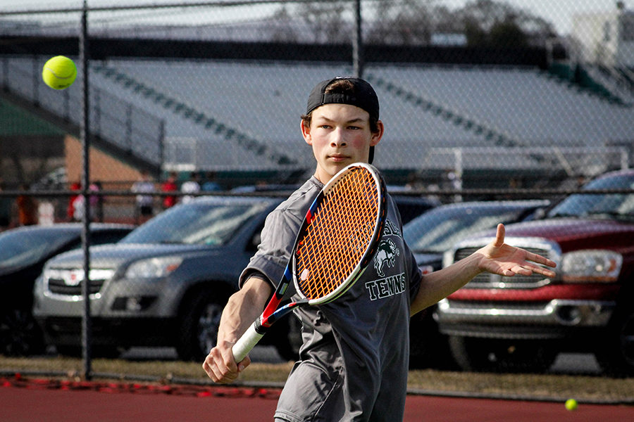 Varsity player Matthew Presite prepares to volley a tennis ball over the net. This is Presites final year on the tennis team. 