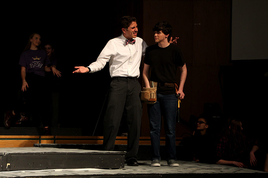 Bennett L Solomon (left) speaks with Mick OSullivan (right). Moth, played by OSullivan, is visiting Navarre High School and is tasked with stage maintenance.
