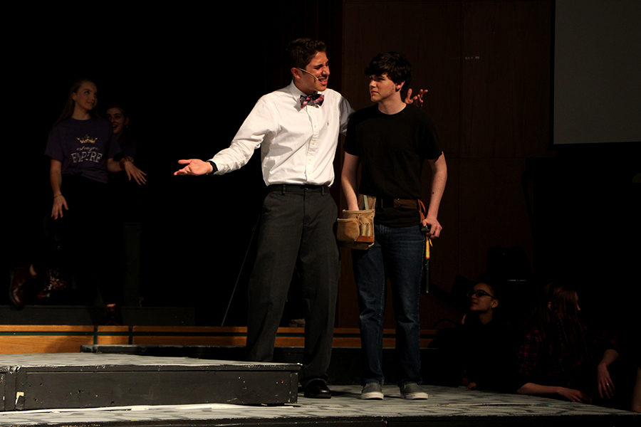 Bennett L Solomon (left) speaks with Mick O'Sullivan (right). Moth, played by O'Sullivan, is visiting Navarre High School and is tasked with stage maintenance.