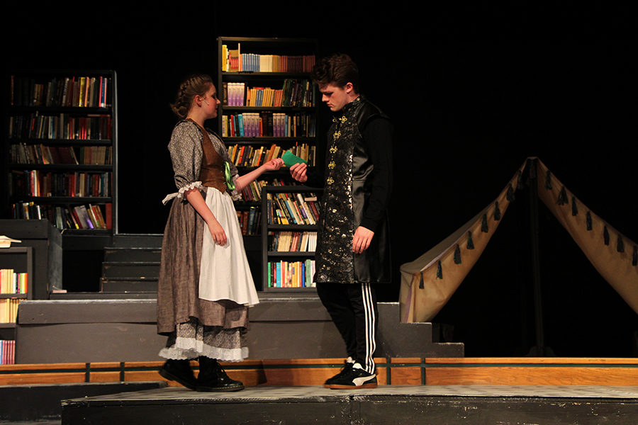 Anna Crawford (left) and Nick Bowman (Right) exchange a letter. Shakespeare is known for using fake or misplaced letters in his plays to create conflict.