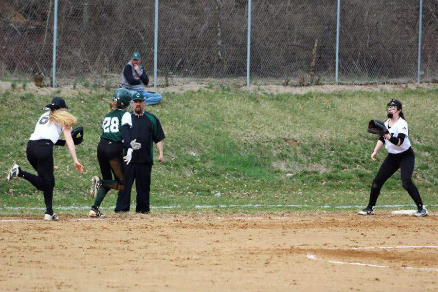 A returning sophmore, Ashley Glenn, gets into a pickle at third. They have a long running back and forth batter, but Glenns speed allowed her to come out safe in the end.