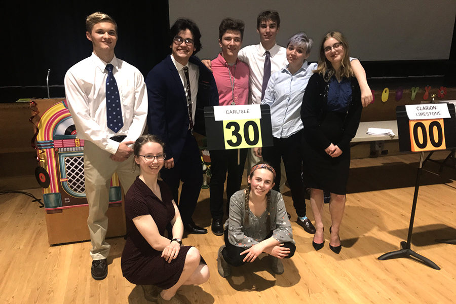 From left: Eli Plant, Lillian Sweeney, Brady Chilson, Ellie Knapp, Salko Hrnjic , Hayden Edwards, Condor Hall, and Ava Wendelken pose as a team after the state Academic Decathlon competition. All eight students competed on March 15 and March 16.