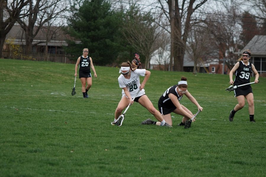 Kayla Reifsteck retrieves the ball in the girls lacrosse game against Central Dauphin East on Apr 8.  