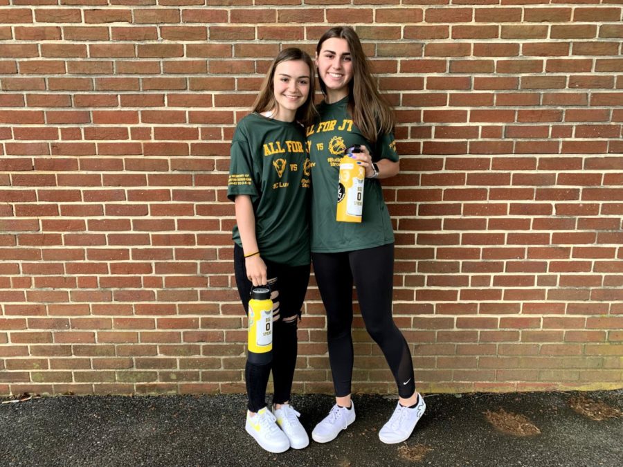 Heidi Heinlein and Kathleen ONeill pose with their JT shirts and stickers. Many mementos were created in order to keep JTs memory alive.  