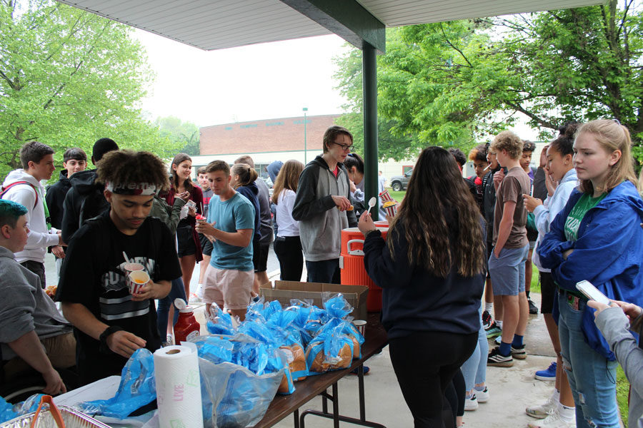 Student Council members Olayah Safouan and Mabel Sheesley serve hotdogs and Ritas Italian Ice at the Springfest Carnival. Student Council is responsible for organizing the Carnival. 