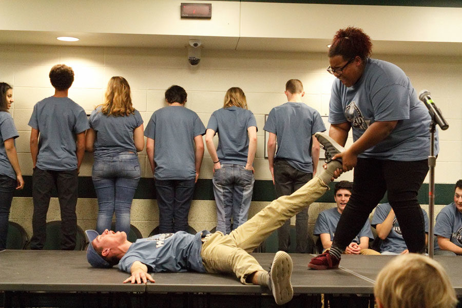 During a game of Blind Freeze Tag, junior member Matthew Keating is pulled across the floor by fellow junior Brooke Carpenter, during a fall performance.  The troupe organized the Wingin Fit to capitalize on their physicality while also helping them raise money for their trip to Chicago this summer. 