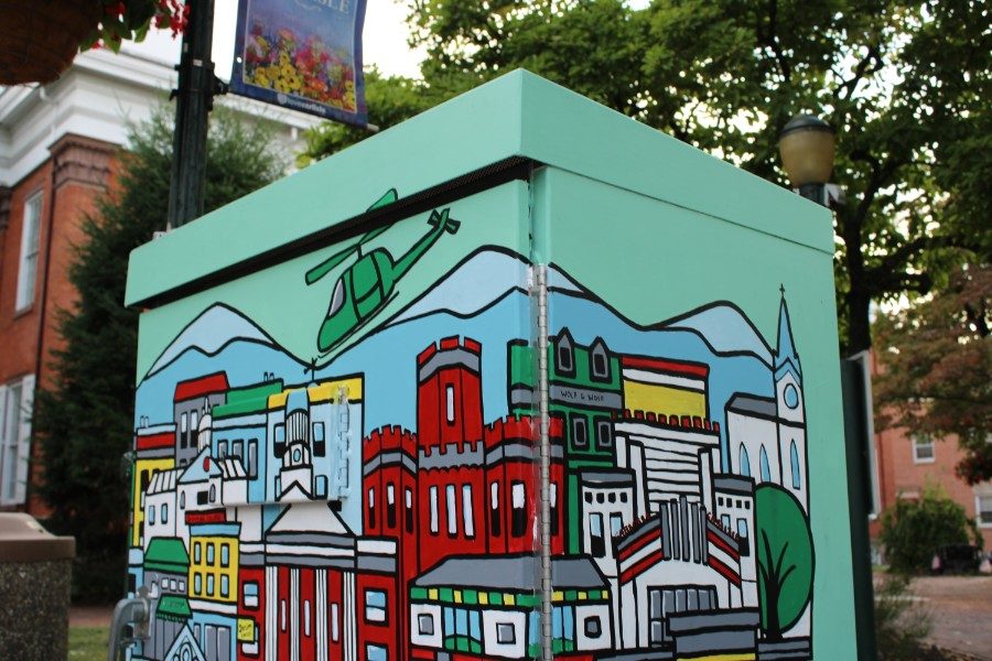 One of the many electrical boxes sponsored by Color Carlisle sits in the town square. The box was designed and painted by art teacher Amie Bantz.