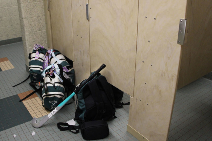 Girls field hockey has to change in the bathrooms due to not having a locker room this season.  Field hockey is one of three girls teams in this situation.