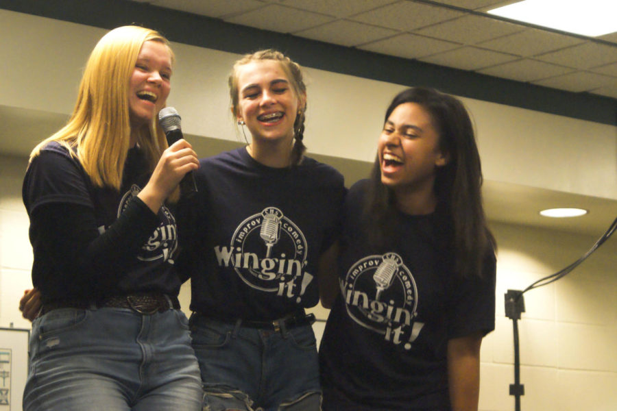 Juniors Reese Daugherty, Josetta Checekett, and Trinity Johnson laugh together while playing a game.  The Wingin It ! shows will not only get audience members laughing but members of the troupe too.  