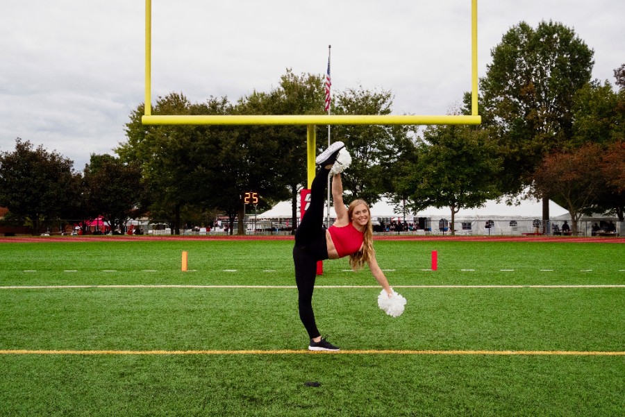 Grace Winton strikes a pose in her dance team uniform at the Catholic University of America. Winton danced with Carlisle Dance before entering college.