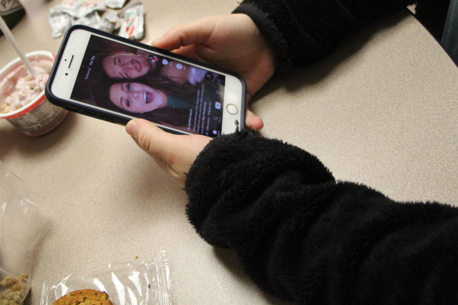 Students spend time during lunch scrolling through and watching Tik Toks. Is the popular social media app in danger of being shut down?  