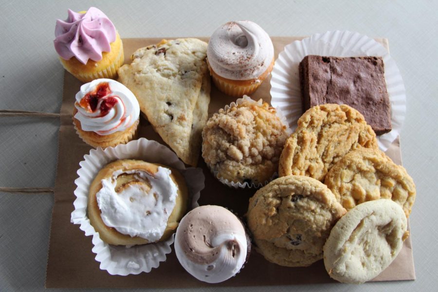 An assortment of cupcakes, brownies, cookies, scones, and cinnamon rolls are laid out from Nothing Sweeter.  This bakery is new to Carlisle and is located on Pomfret St.  