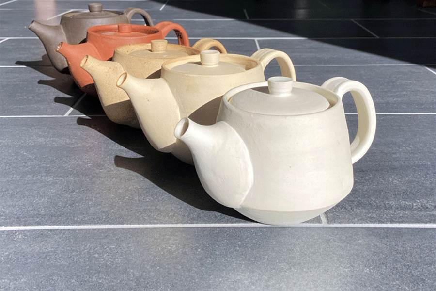 Lamberton+Middle+School+student+Ella+Shatz+designed+and+created+five+hand-thrown+teapots.+Each+teapot+was+glazed+in+a+different+color+and+displayed+together+as+one+work+of+art.+