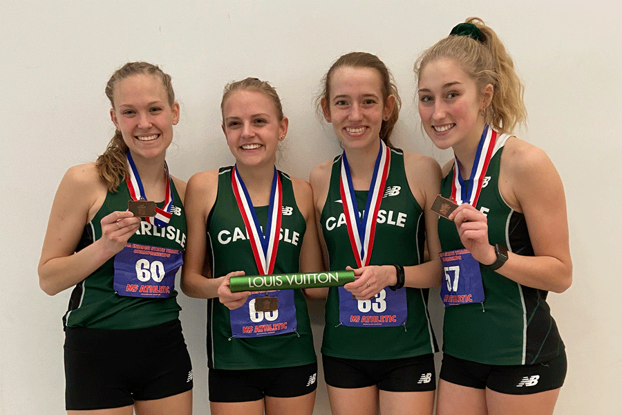 Seniors Savannah Hossfeld and Sophia Toti and juniors Sophie Salomone and Alyssa Dyson proudly show off their medals after placing third at the distance medley relay at the state competition. Hossfeld, Toti and Salomone, with the help of junior Karlie Powell, will all race in the 4 x 1 mile at Nationals in NYC on March 14.