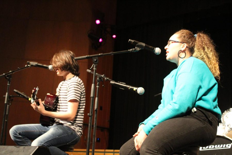 PARTNER ACT: Sophomore Annie Chovanes sings acapella in her duo with fellow sophomore Caleb Finnegan in last years winter Coffeehouse, The Refill. This years fall event, The First Cup, will be a virtual experience through Zoom.  