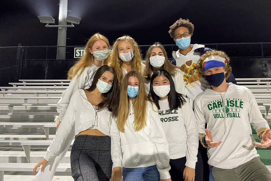 A CHANCE TO CHEER: Seniors had the opportunity to attend their first football game of the year, a rescheduled matchup against State College. top (left to right): Cara Sandefur, Bryn Lafferty, Kathleen O’Neill, Noah Patterson
bottom (left to right): Lulu Herman, Lydia Welling, Maya Neiberg, Jonathan Cox. Carlisle lost, 29-38. 
