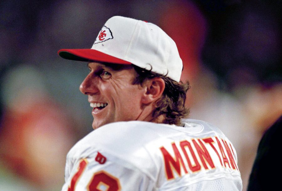 FILE - In this Dec. 12, 1994, file photo Kansas City Chiefs quarterback Joe Montana watches from the sidelines during an NFL football game against the Miami Dolphins. Hall of Fame quarterback Joe Montana and his wife confronted a home intruder who attempted to kidnap their grandchild over the weekend, law enforcement confirmed on Sunday, Sept. 27, 2020. (AP Photo/Han Deryk, File)