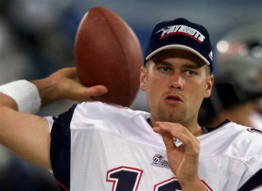 FILE - In this Aug. 4, 2000, file photo, New England Patriots backup quarterback Tom Brady warms up on the sidelines before an NFL football game against the Detroit Lions at the Silverdome in Pontiac, Mich. Brady grew from a sixth-round draft choice into one of the best quarterbacks in NFL history. On Tuesday, NFL commissioner Roger Goodell hears Brady's appeal of a four-game suspension for using deflated footballs in the AFC championship game. How will that affect Brady's legacy? (AP Photo/Carlos Osorio, File)