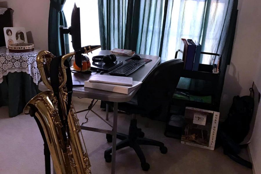 HOME STUDIO:  Sophomore Connor Lindsay prepares for a day of remote learning, including symphonic band.  The music classes have had to get creative to continue making music together.