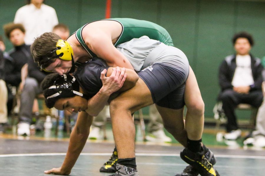 Junior Jarrett Wilson wrestles an opponent from Harrisburg during the 2020 season. 