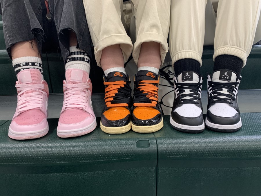 Air Jordan 1s are back! Ava Grippin, Heidi Heinlein, and Breonna Reiber show off their kicks in the above photo. Sneaker hype has always been a thing but this year the re-selling of Jordans market has skyrocketed. 