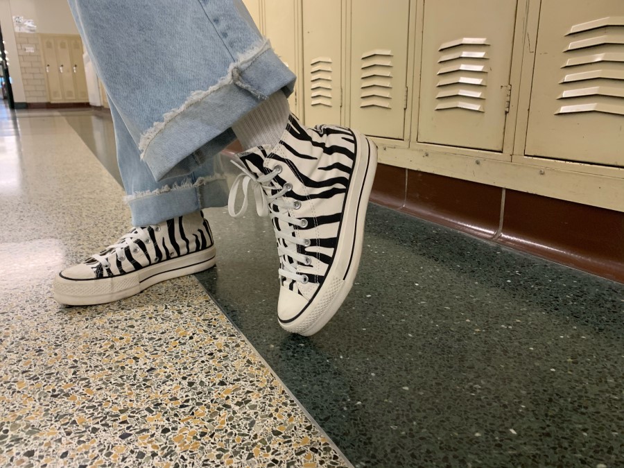 Alyssa Dyson shows off her favorite Christmas gift, platform converse. Platform shoes have come back into trend, giving those who wear them a couple inches to add to their height. A little bit of a platform adds spice to any regular shoe. 