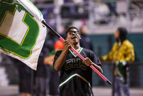 LEADING THE WAY: CHS sophomore Ian Hill proudly leads the cheers at a home football game this fall. The only male cheerleader at CHS, Hill has faced criticism with a smile on his face. You do whatever you want to do and whatever makes you happy,
you go ahead and fulfill your dreams.