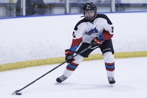 GLIDING DOWN THE ICE: Peyton Mitchell of the Capital City Vipers carries the puck across the ice. Mitchell has been playing hockey for five years now. 