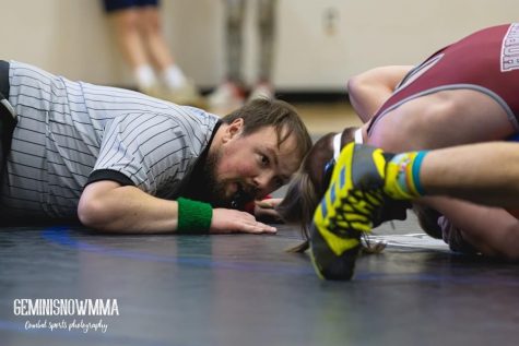 PINPOINT PRECISION: As a high school wrestling referee, Carlisle High School Alumni Nathan Towery gets up close and personal. After volunteering to help make wrestling a sanctioned sport in Mississippi, Towery was offered the opportunity to continue this passion. 