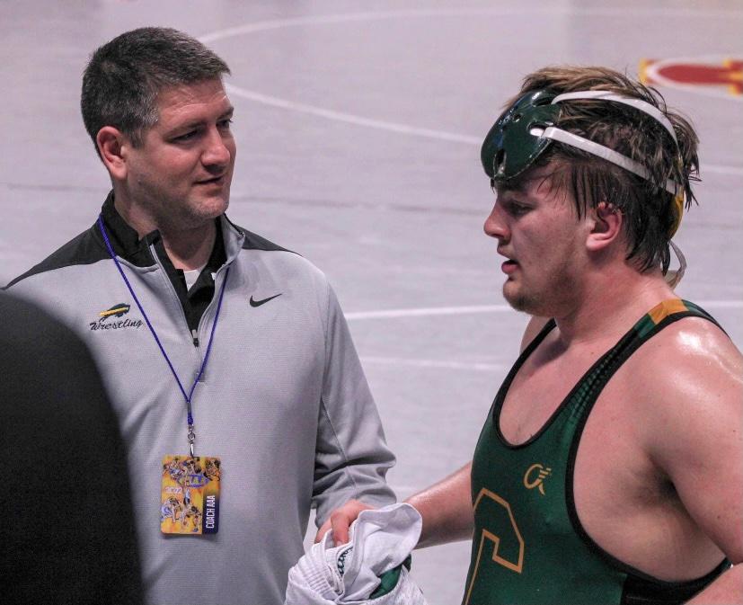 TIME+FOR+A+BREATHER%3A+Layton+Schmick+chats+with+coach+Jake+Wilson+after+one+of+his+rounds+at+the+PIAA+state+wrestling+championships+%28March+11-12%29.++Schmick+recorded+32+pins+this+season%2C+beating+the+Carlisle+record+for+most+pins+in+a+season+%2825%29+set+by+Ian+Shannon+in+2013.