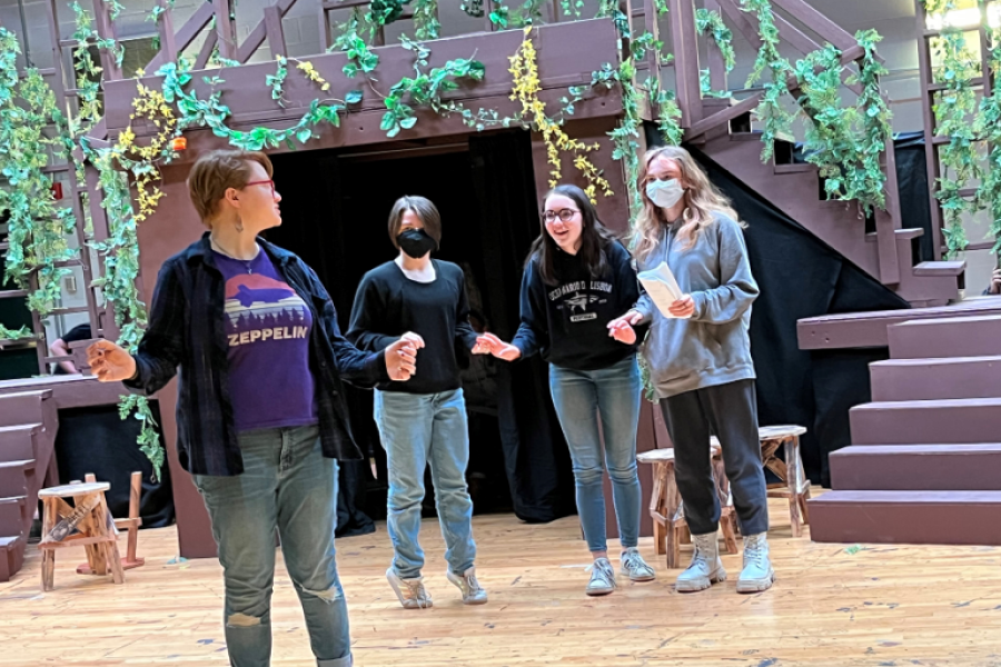 STAGING FOR SHAKESPEARE: The writer (second from right) and her fellow castmates rehearse for the upcoming performance of Shakespeares A Midsummer Nights Dream. This is just one of the shows that has helped the writers love for theatre blossom. 