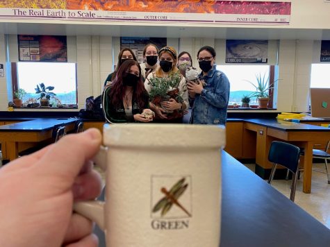 COMING TOGETHER: The Green Team has been working all year to find ways to make CHS more eco-friendly, including adding composting bins in the cafeterias and keeping track of air quality through a flag system. However, the group also makes time to have fun, as seen here in their mug shot for the Coffeehouse annual challenge, which they won.