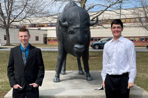 WINNERS CIRCLE: First place winner Tucker Wise (left) and second place winner  Max Behfar (right) are pictured next to the schools bison statue after their wins at the CASAC fair. Wise investigated Lure Density and Movement and Behfar researched airplane aerodynamics.