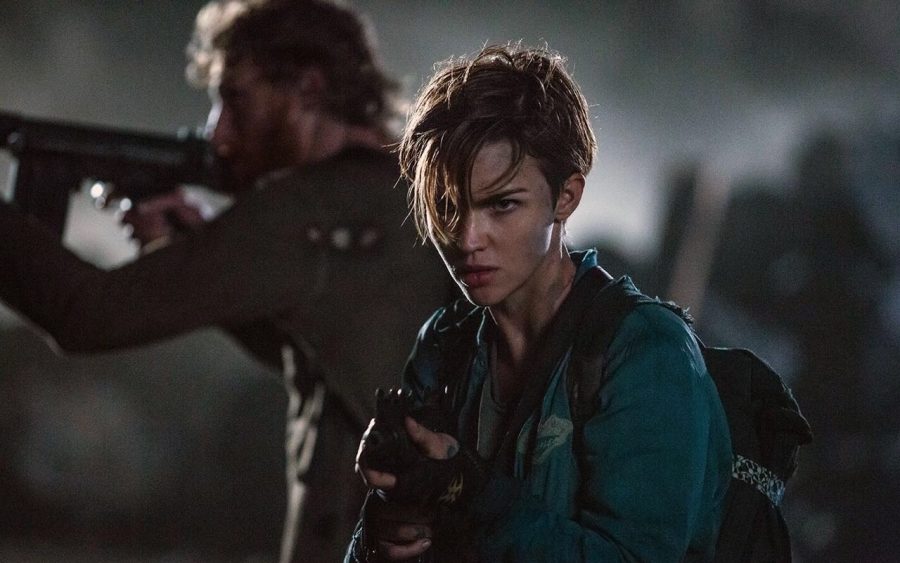 Abigail (played by Ruby Rose) and Albert Wesker (Shawn Roberts) get ready to fight some zombies in Resident Evil: Final Chapter.