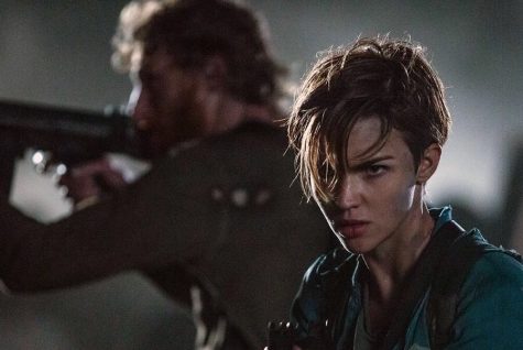 Abigail (played by Ruby Rose) and Albert Wesker (Shawn Roberts) get ready to fight some zombies in Resident Evil: Final Chapter.