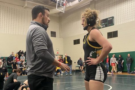 ADMIRAL ADVICE: Girls wrestling head coach Vinny Anceravage coaches up CHS Junior Katelyn Coldren at MyHouse Pennsylvania State Championships. Coldren went on to finish 6th out of 27 wrestlers. The girls state championships were hosted by Central Dauphin High School and hosted hundreds of the best girls wrestlers in the state.