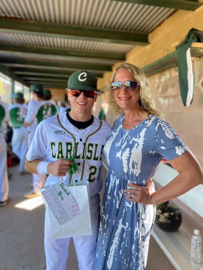 Senior English teacher Michelle Disbrow joins senior Connor Morrow for teacher appreciation night at George Bowen field for varsity baseball. 