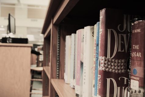 Books presented on a bookshelf at the Carlisle High School library.