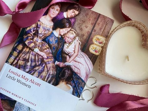 WRITING AND RIBBONS: Jennas personal copy of Little Women lays adorned with some of her stereotypically feminine belongings.