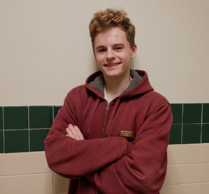 Isaac Richins, a junior at Carlisle High School, poses in the hallway outside of his video production classroom. 