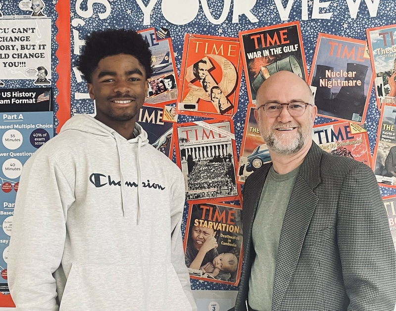 STANDING TOGETHER: This photo contains the two main contributors in the process of the approval course, student and teacher; Stroud (left) and Wagner (right) together in his classroom.