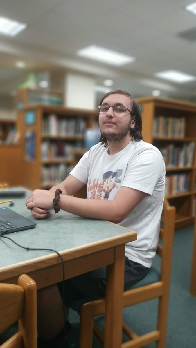 Talan Salinger (junior), works in the library. When asked to rate his feelings about the Eras Tour movie, he said, "Honestly, I'm not really a Swiftie, so I'll say a two or three because I just don't really listen to Taylor Swift."