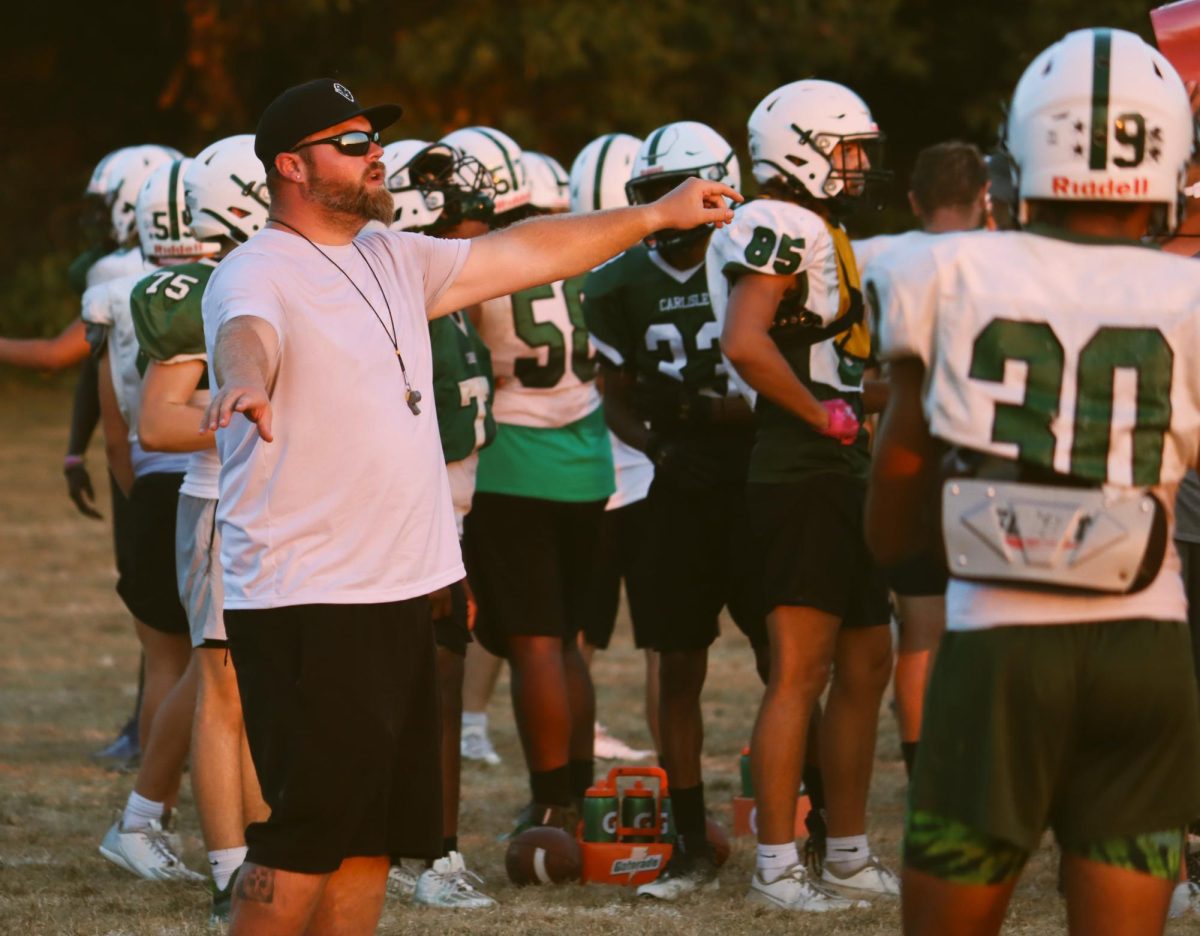 Focusing on the little things: Spotlight on new football coach, Brandon Cook
