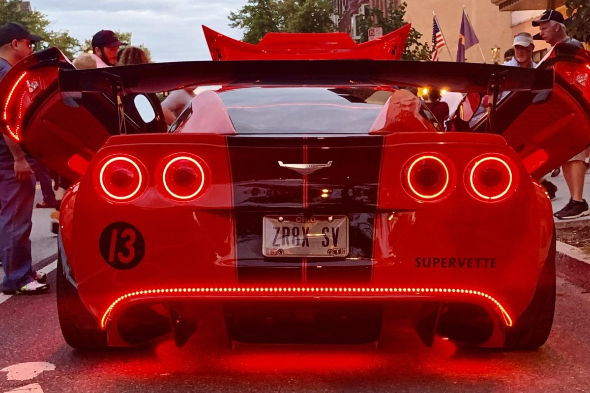 RED AND READY: A vigorous shot of a modded C6 Corvette with Scissor Doors.