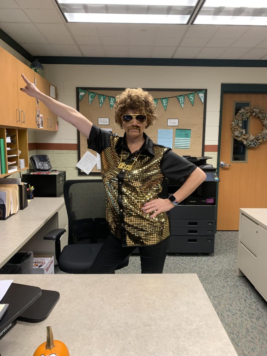 Ms. Rarick, administrative assistant to Dr. Buffington, is getting groovy on 70s day!
